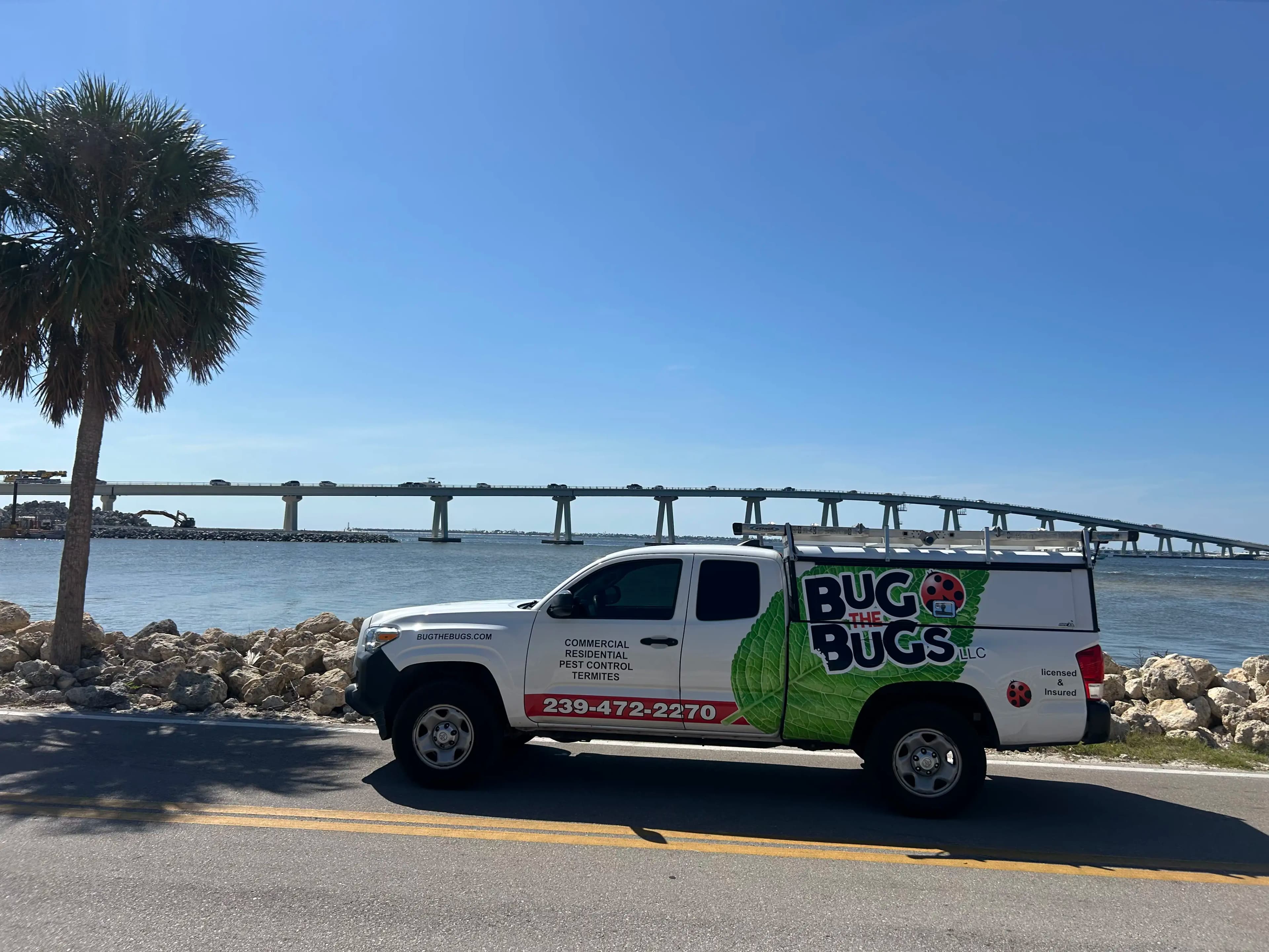 Bug The Bugs service truck beside a Southwest Florida waterfront